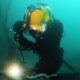 Commercial diver performing wet underwater welding.